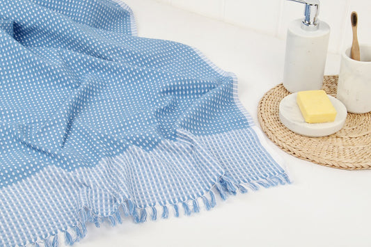 The benefits of using thin bath towels instead of terry cloth towels.